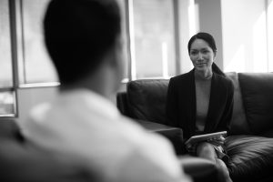 woman interviewing a male candidate for a job